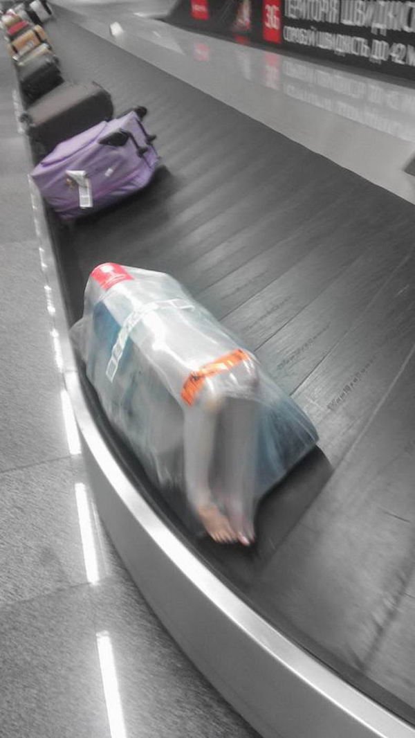 funny pics - human body wrapped up in plastic on airport conveyer belt