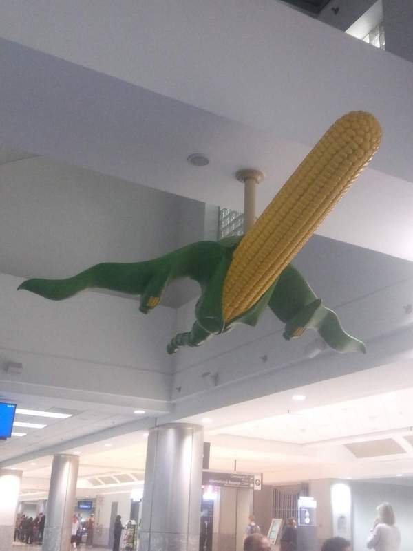 funny pics - airport statue corn cob shaped like plane
