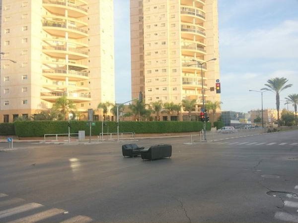 funny pics - two couches abandoned in the middle of the street