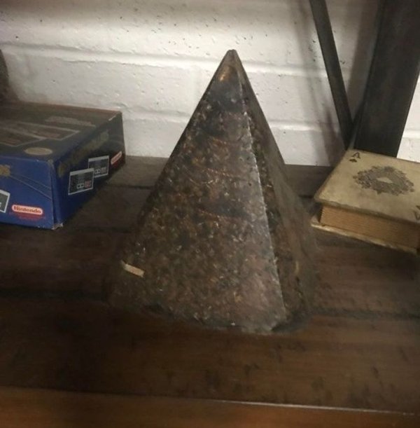 My boyfriend and I bought a house and found these pyramids all over, hidden in different places (corners, attic, in a wall, outside). Has anyone seen these before and can you tell me what they are/mean?