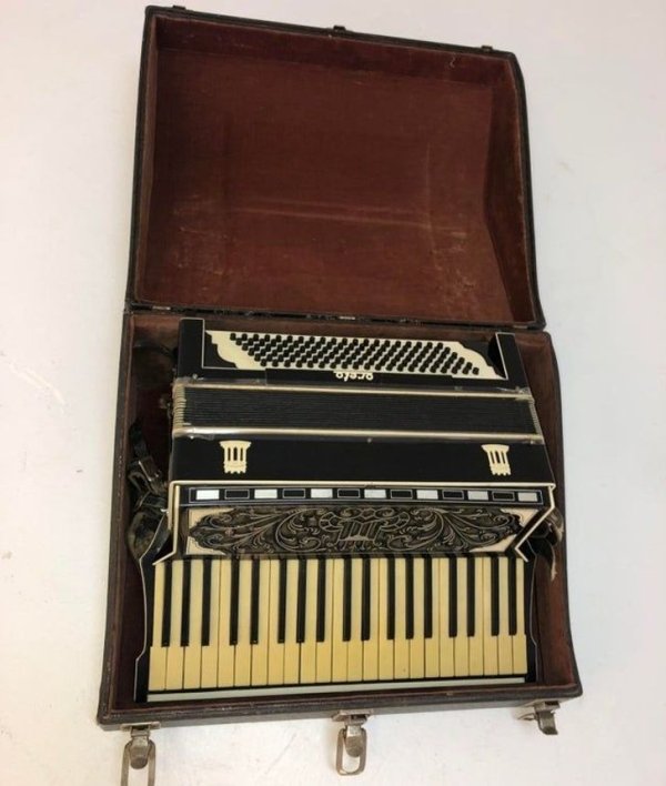 Cleaning up the house and found an old accordion hidden away. I looked and looked for the name ‘Oreto’ but couldn’t find a brand. It seems very old and was made in Italy.