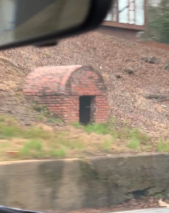 What are these small brick buildings on the roadside near historic buildings in Georgia?

A: Natural springs