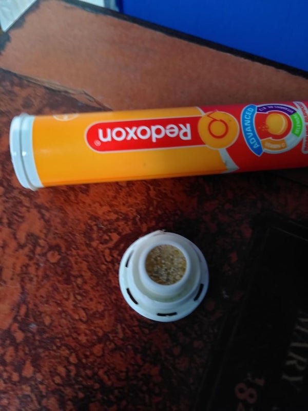 The cap on this tube of vitamin tablets tore open and there are tiny balls inside

A: They keep the tablets dry