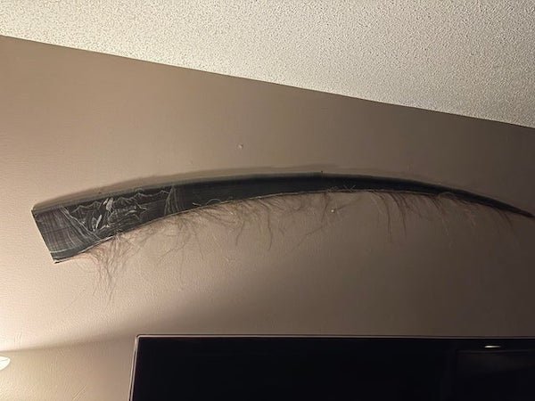 Used as a decorative wall hanging. Notice the engraving, it might be relevant.

A: It’s baleen from a whale, the “teeth” of filter feeding whales. Ironically, the orcas pictured on it aren’t baleen whales.