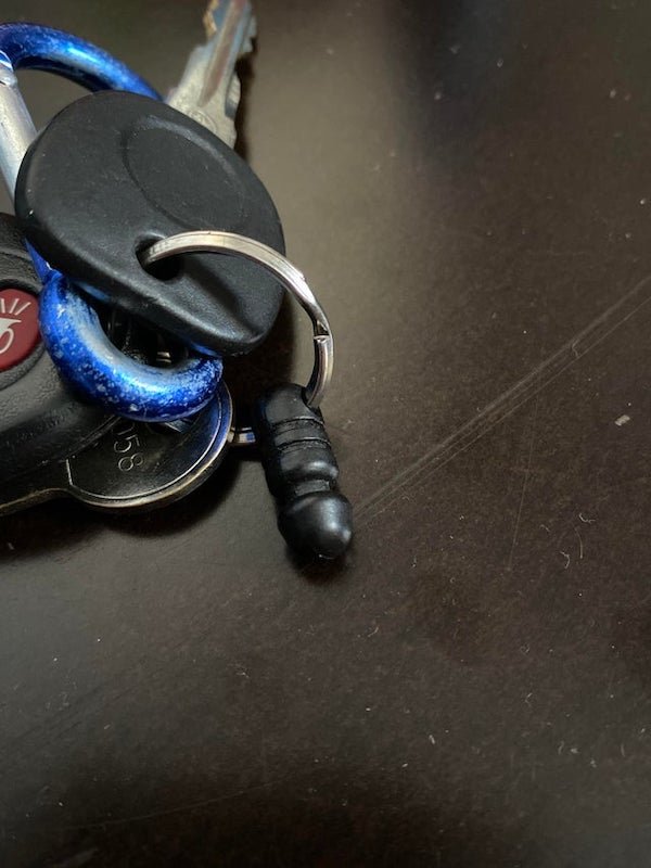 This little black plastic nub on my key ring

A: Quick-release key chain part. It’s for the key fob for the security system.