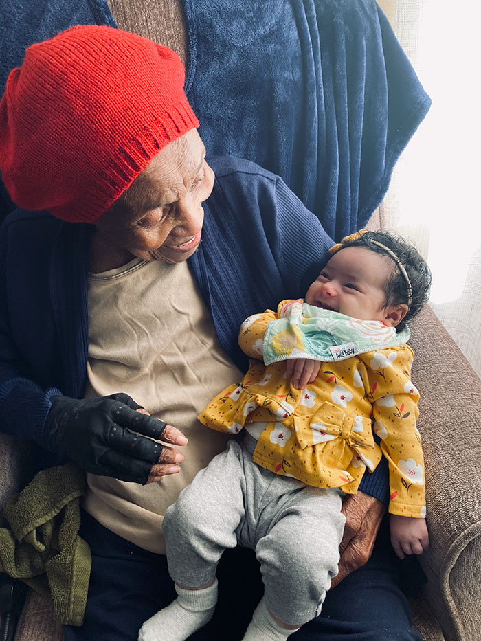 feel good pics - old person hanging out with little baby
