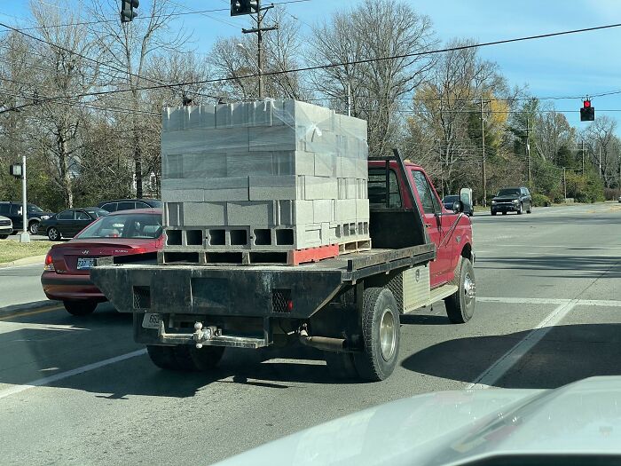 funny construction fails - truck carrying stack of cinderblocks