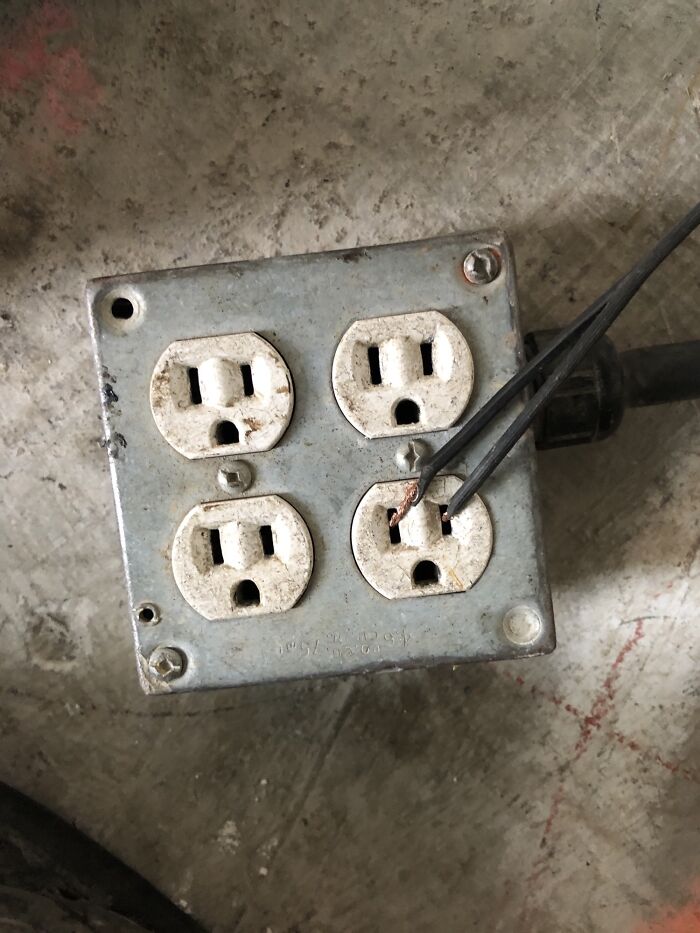 funny construction fails - metal wires going into electrical socket