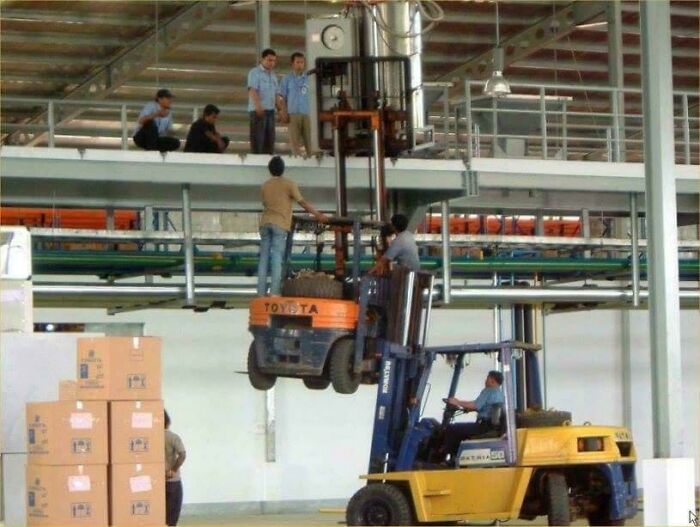 funny construction fails - forklift lifting another forklift