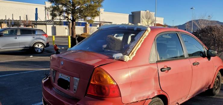 funny pics - car with back windshield barely stuck on