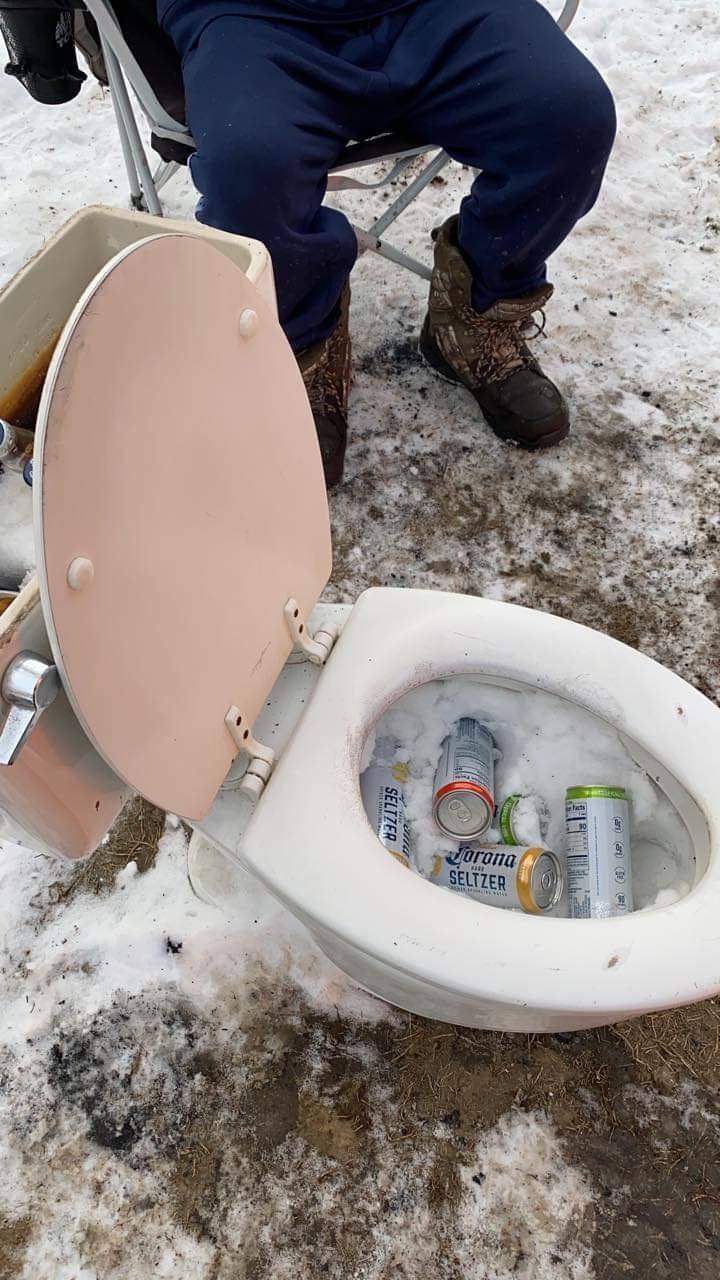 funny pics - guy using a toilet to chill beer