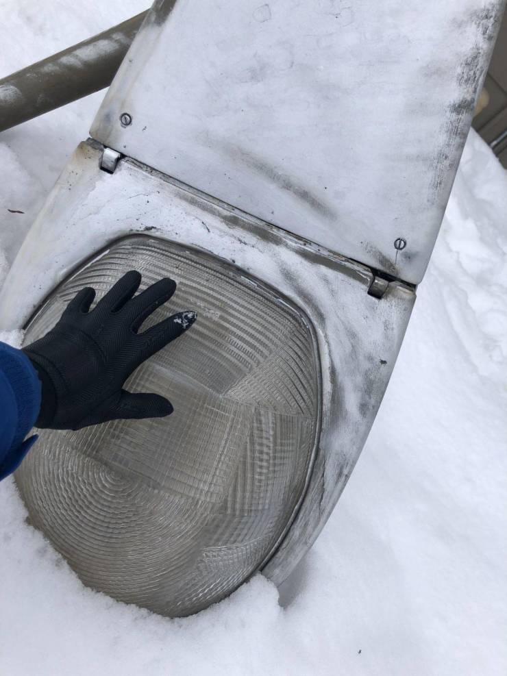 “A street lamp fell over into the snow outside my apartment. Turns out they’re massive- my hand for scale.”