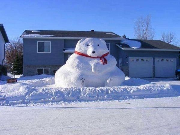 funny pics - giant snowman sculpture wearing red scarf