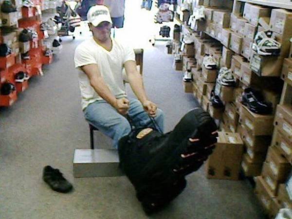 funny pics - man trying on giant boot
