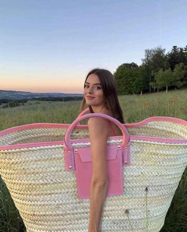 funny pics - woman carrying pink giant wicker bag