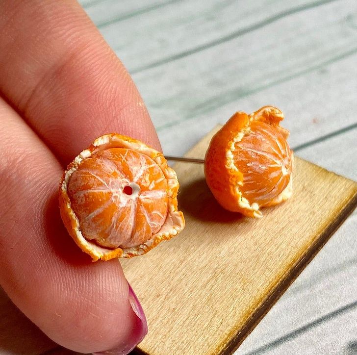 “Tangerine stud earrings made of polymer clay”