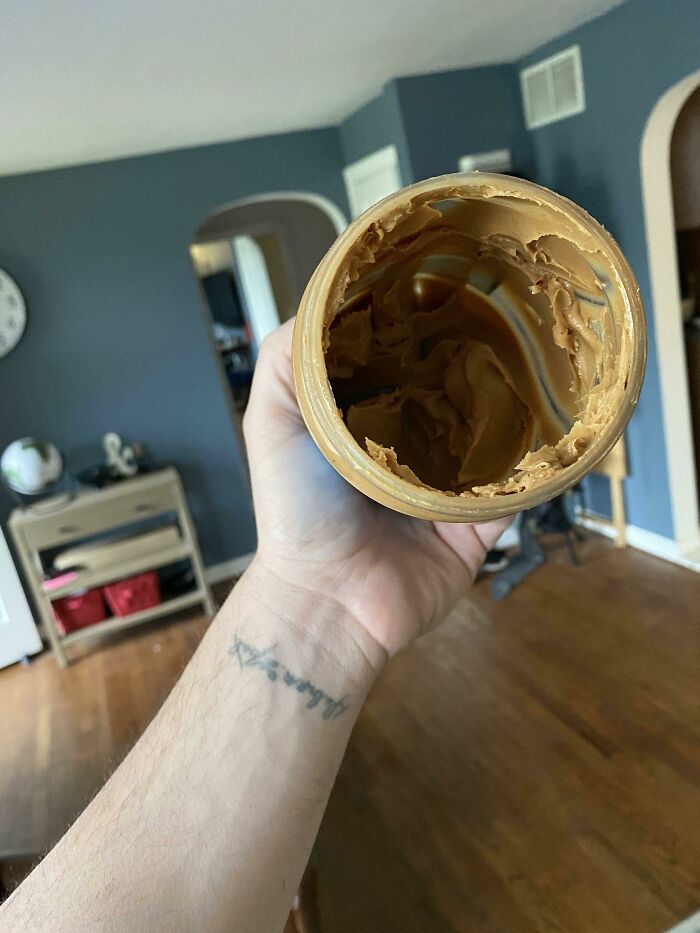 funny bad roommate pics -- guy holding empty peanut butter jar