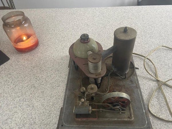 What is this thing? Found sitting up in an attic, looks like its been there a while from previous owner

A: Wilesco Nuclear Plant Steam Engine. Water goes in and steam comes out.