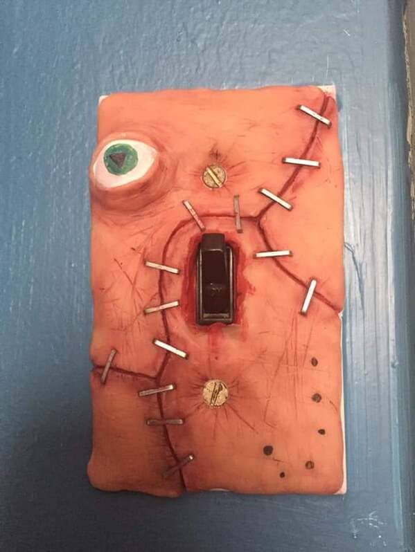 This polymer clay lightswitch cover my brother made for his room