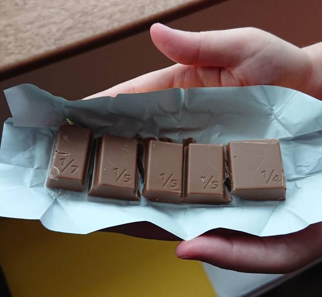 “This chocolate bar is divided into unequal pieces.”