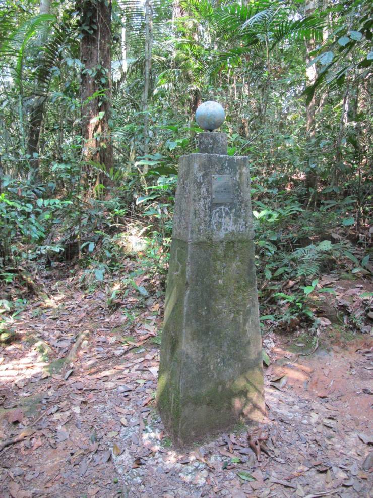 “While hiking an isolated jungle trail in the Amazon, we came across this post marking the equator.”