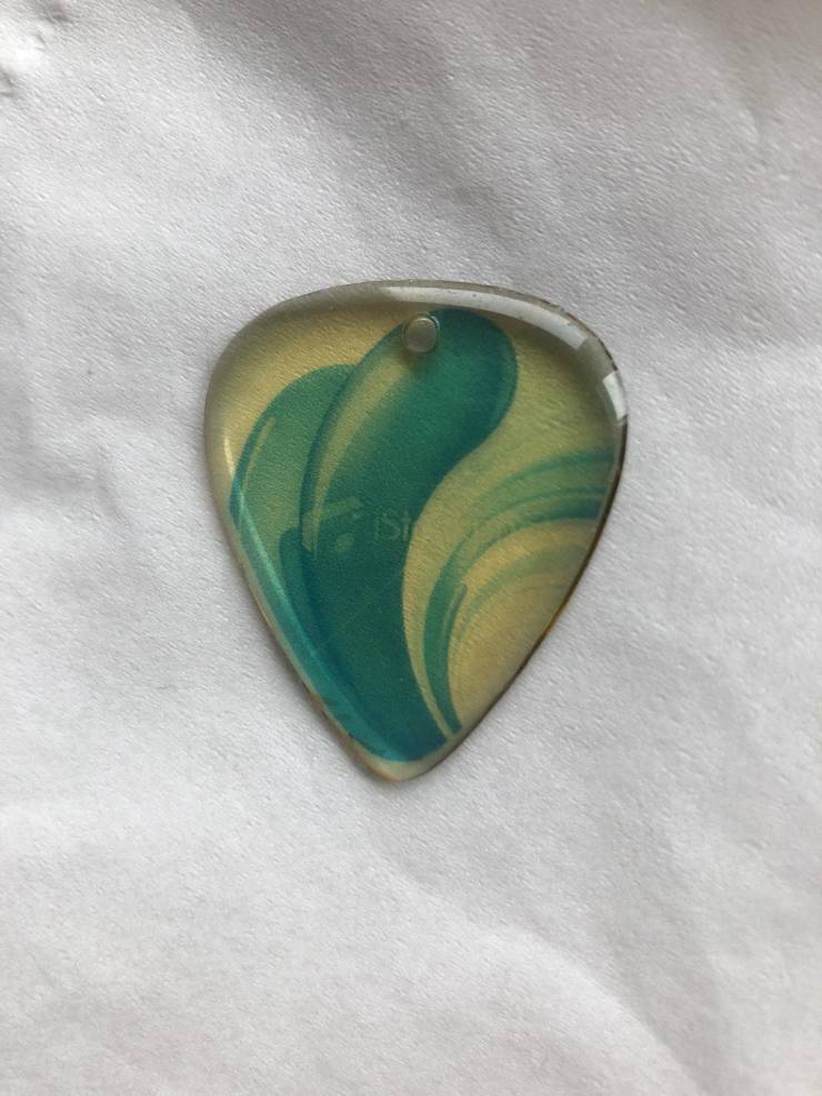“The people who made my guitar pick couldn’t be bothered to buy the stock photo.”