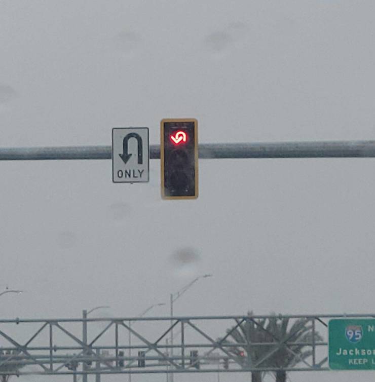 “First time I have ever seen a light with a U turn symbol..”