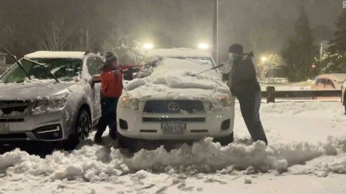 boy 10 and his friend clean snow off cars of hospital staff to -