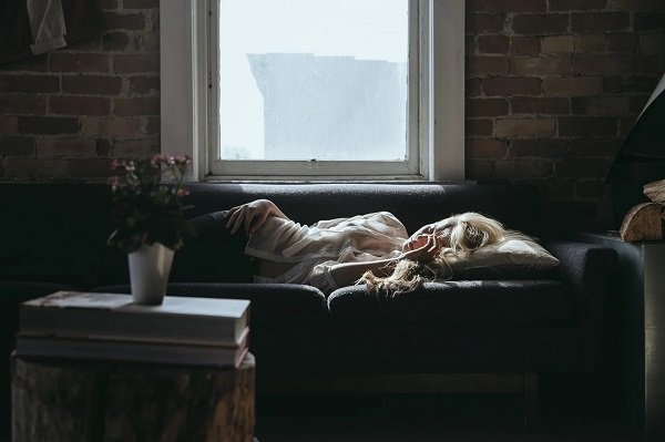 sad blonde woman sleeping