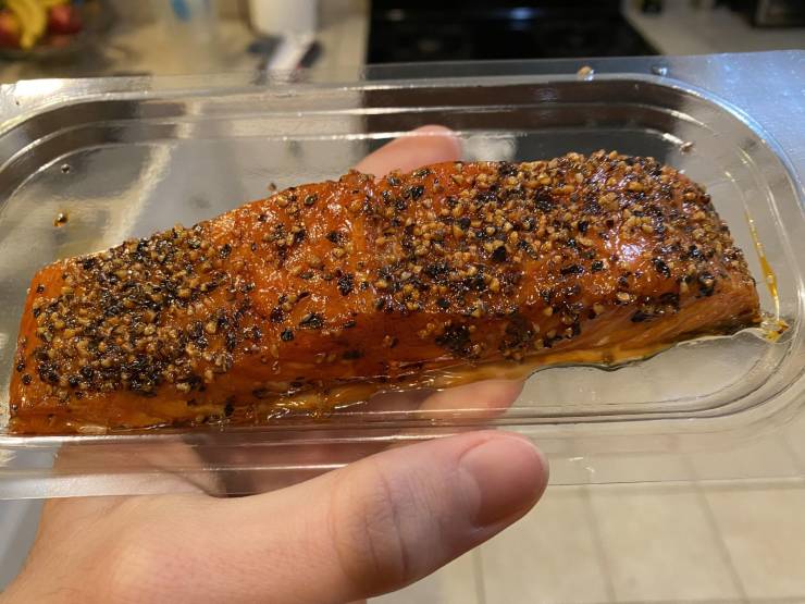 “This imported salmon, so tightly wrapped in plastic it appears to not he wrapped at all.”