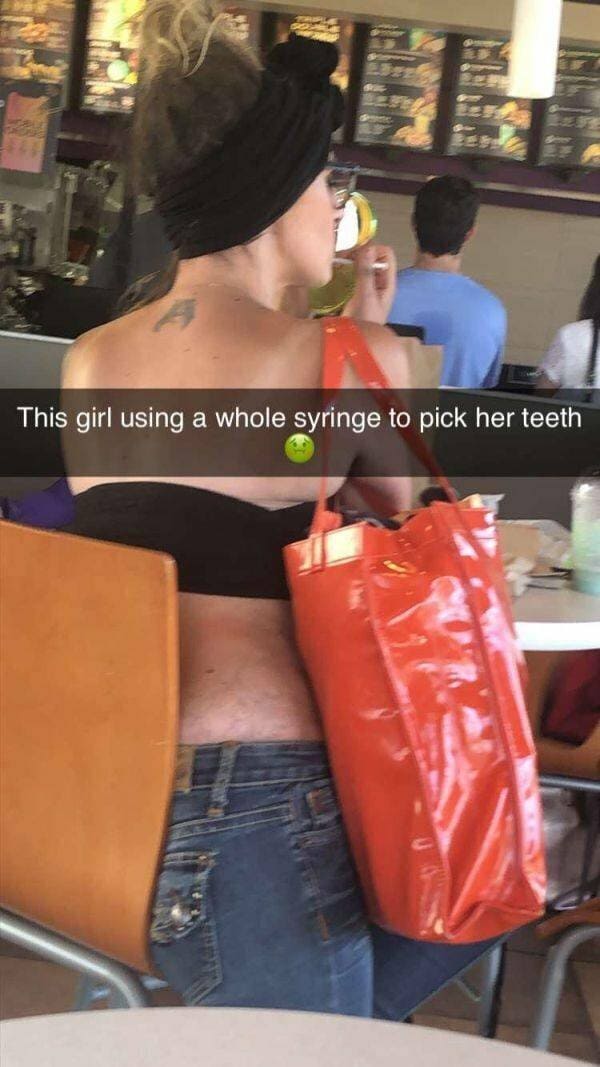 shoulder - This girl using a whole syringe to pick her teeth