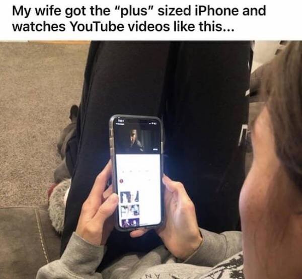 mobile phone - My wife got the "plus" sized iPhone and watches YouTube videos this... .. Nv