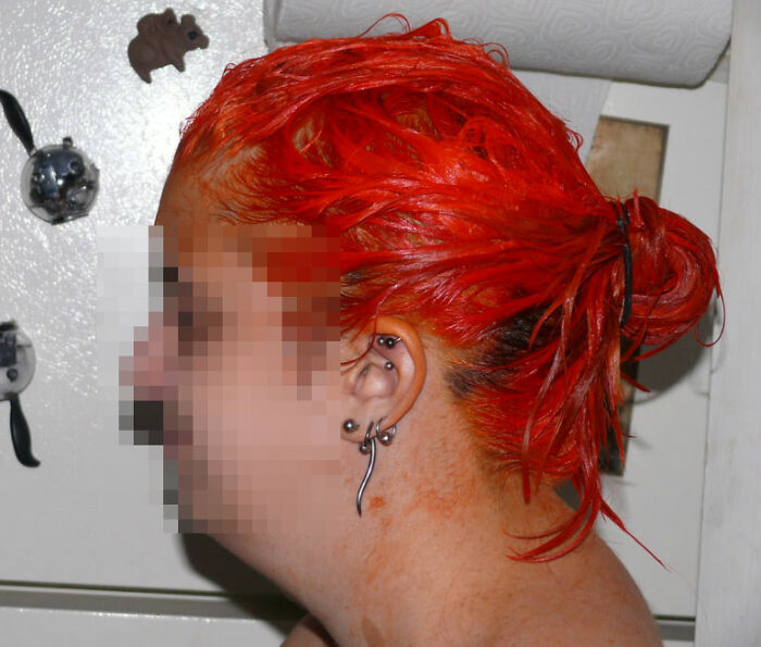 bad house guest habits - woman with red dyed hair