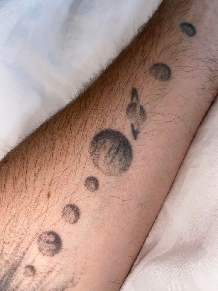 “I tattooed the solar system on my forearm and later got a mole on Jupiter which now represents its Great Red Spot.”