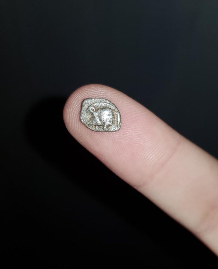 A tiny Greek silver coin which is 2500 years old.