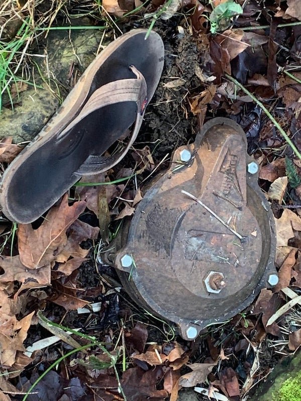 [Northern Oregon] Buried metal plate found in side yard, stamped ‘Harvard’ ( sandal for scale )

A: That’s your average well head.