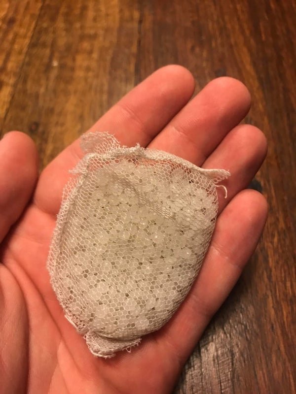 Small mesh bag filled with small pearl like balls

A: They are silicone desiccant balls.