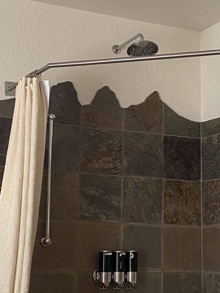 “Shower tiles are cut into mountain shapes, in my hotel in a mountainous destination.”