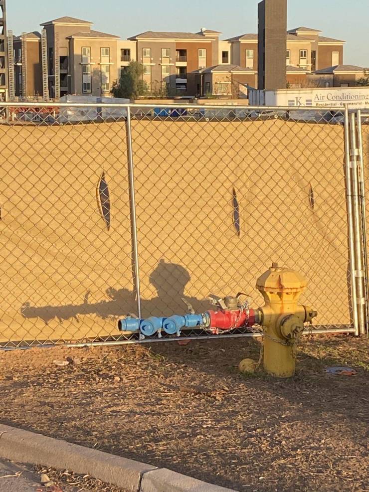 “The shadow of this fire hydrant looks like a soldier holding a rifle.”