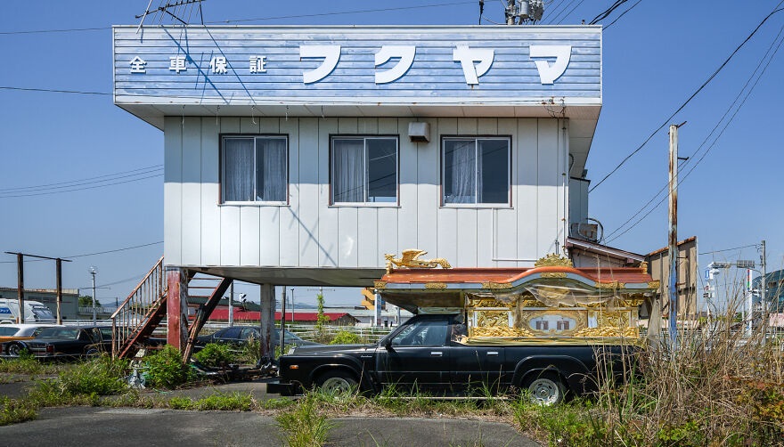 A Japanese Funeral Car, Called A Reikyūsha, Lays Forgotten On An Old Dealership Forecourt