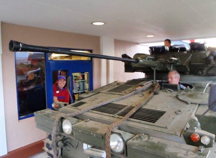 funny pics and memes - driving a tank through fast food restaurant