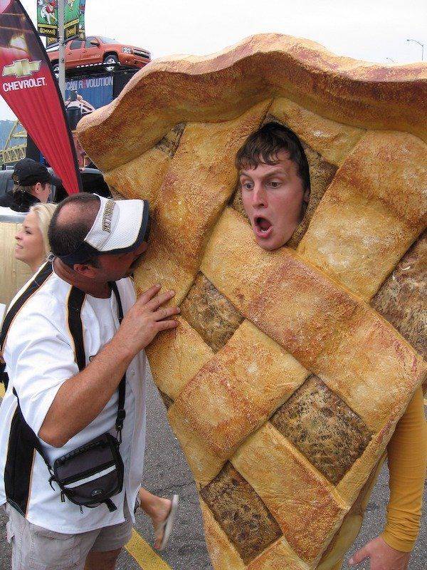 funny pics and memes - guy eating man wearing apple pie costume
