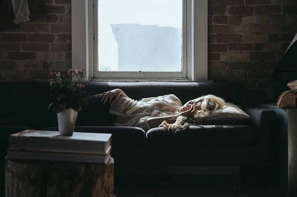 woman asleep on couch in the middle of the day