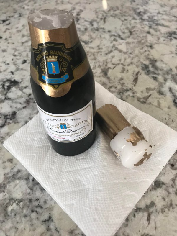 “My wife received a corporate gift from one of her partners for Christmas. It came with candy, champagne flutes, and a small bottle of bubbly. It has been in the fridge since. When we wanted a couple of mimosas yesterday. When I went to open the bottle, I found out it was a candle.”