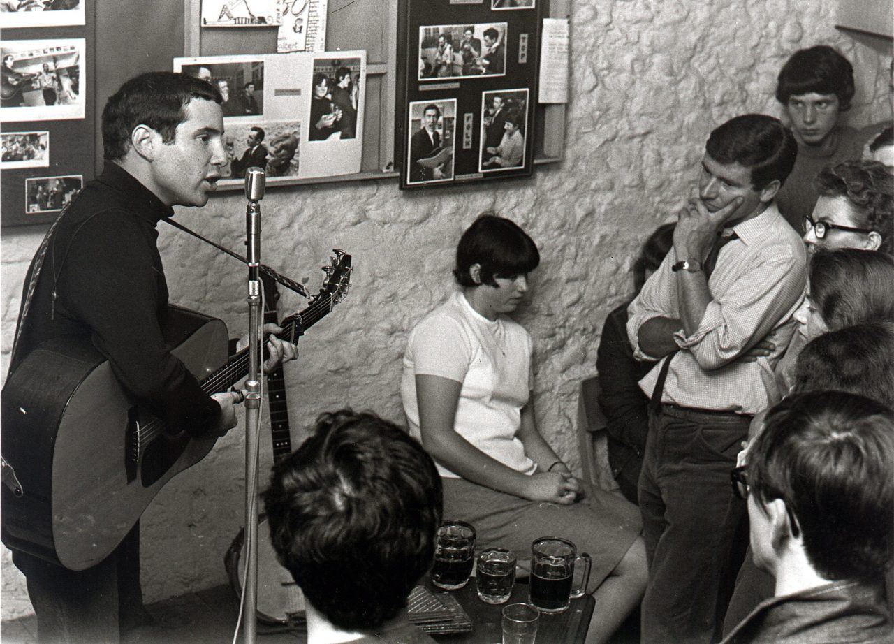 Paul Simon performing at a folk club in England, 1965