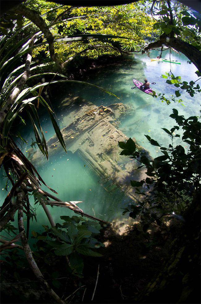 “Japanese WWII Warplane Lies Wrecked in Tropical Riverbed in Palau.”