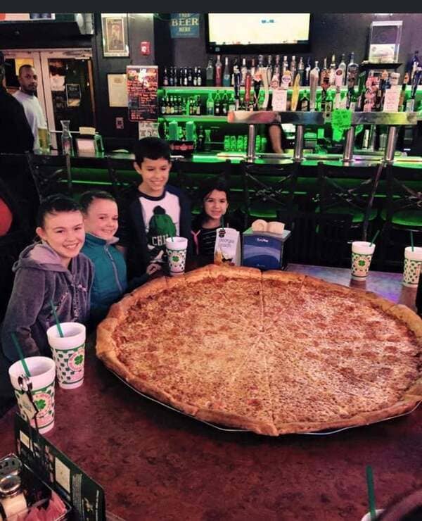 Found this old photo of me and my friends next to this giant pizza.