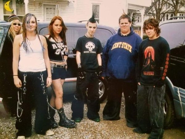 Me and friends before a Disturbed concert in 2006. We’re so cool posing in front of Mom and the van.