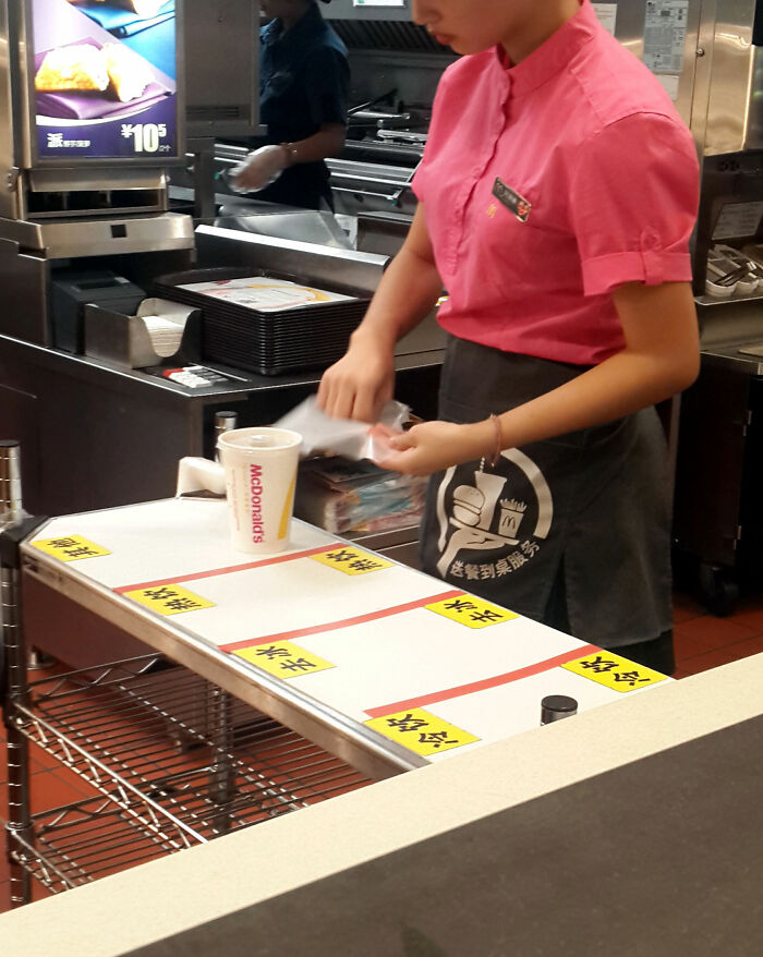 social etiquette rules - woman working at mcdonald's in china