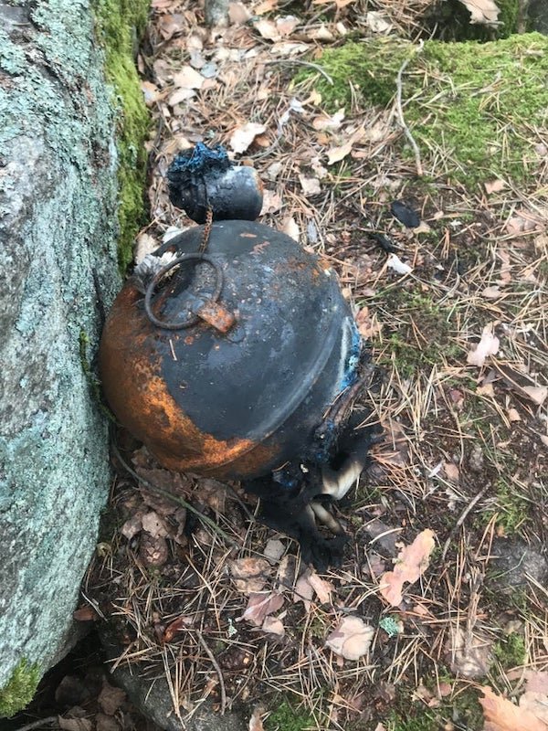 What is this metal object we found in the woods in Stockholm, Sweden?

A: Smudge Pot. Old roadside flare kind of thing.